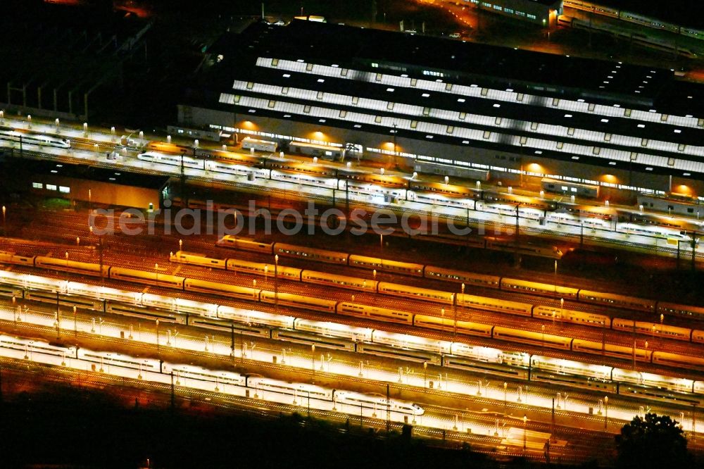 Aerial photograph at night Berlin - Night lighting Railway depot and repair shop for maintenance and repair of trains of passenger transport of the series ICE Werk Berlin Rummelsburg II on Saganer Strasse in Berlin