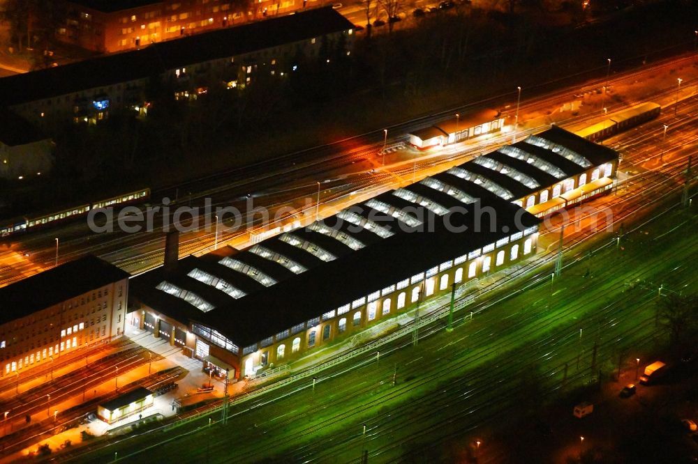 Aerial image at night Berlin - Night lighting railway depot and repair shop for maintenance and repair of trains of passenger transport of the series of S-Bahn Berlin GmbH in the district Lichtenberg in Berlin, Germany