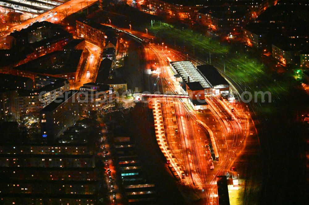 Berlin at night from above - Night lighting railway depot and repair shop for maintenance and repair of trains of passenger transport of the series of S-Bahn Berlin GmbH in the district Lichtenberg in Berlin, Germany