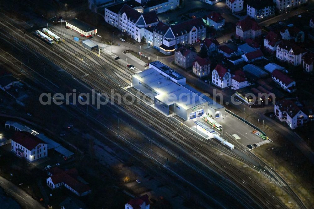Aerial photograph at night Meiningen - Night lighting railway depot and repair shop for maintenance and repair of trains of passenger transport Sued Thueringen Bahn in Meiningen in the state Thuringia, Germany