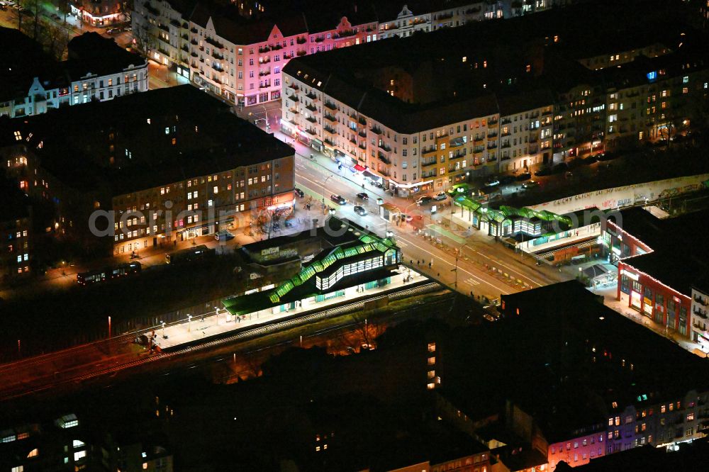 Berlin at night from above - Night lighting station building and track systems of the S-Bahn station on street Hermannstrasse in the district Neukoelln in Berlin, Germany
