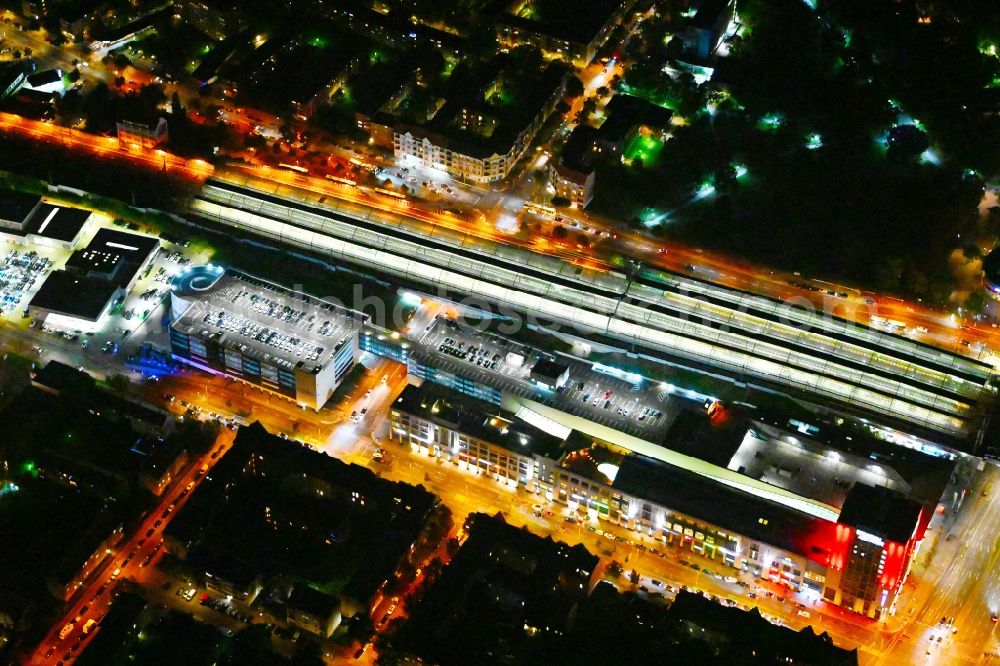 Berlin at night from above - Night lighting station building and track systems of the S-Bahn station Spandau and then shopping mall Spandau Arcaden on Klosterstrasse in the district Spandau in Berlin, Germany