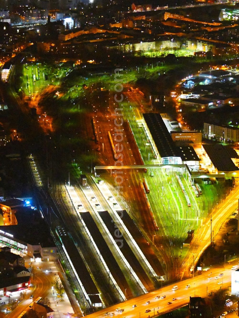 Berlin at night from above - Night lighting Station building and track systems of the S-Bahn station Berlin - Lichtenberg in the district Lichtenberg in Berlin, Germany
