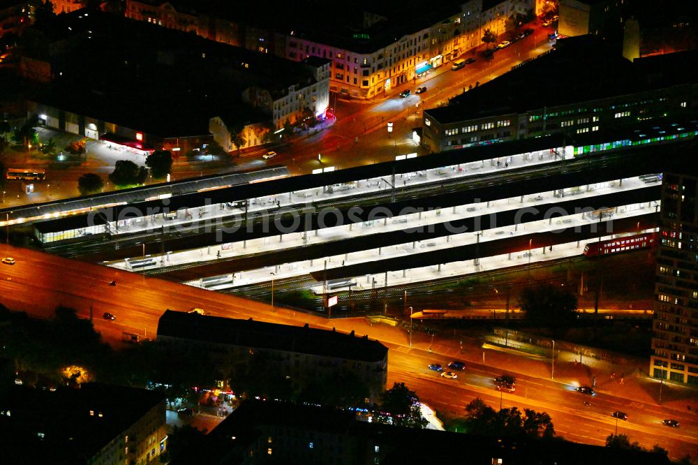 Berlin at night from above - Night lighting Station building and track systems of the S-Bahn station Berlin - Lichtenberg in the district Lichtenberg in Berlin, Germany