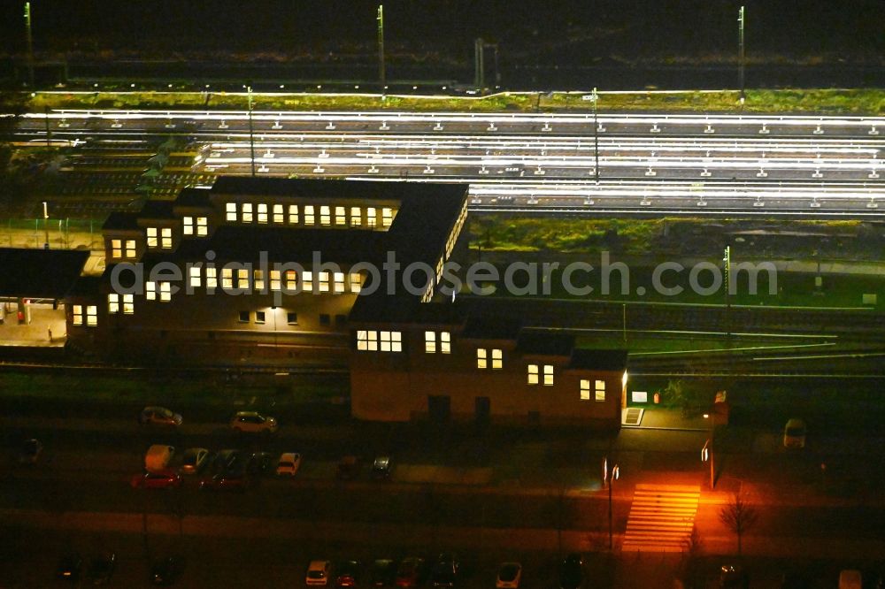 Aerial photograph at night Berlin - Night lighting station building and track systems of Metro subway station U-Bahnhof Hoenow in the district Hellersdorf in Berlin, Germany