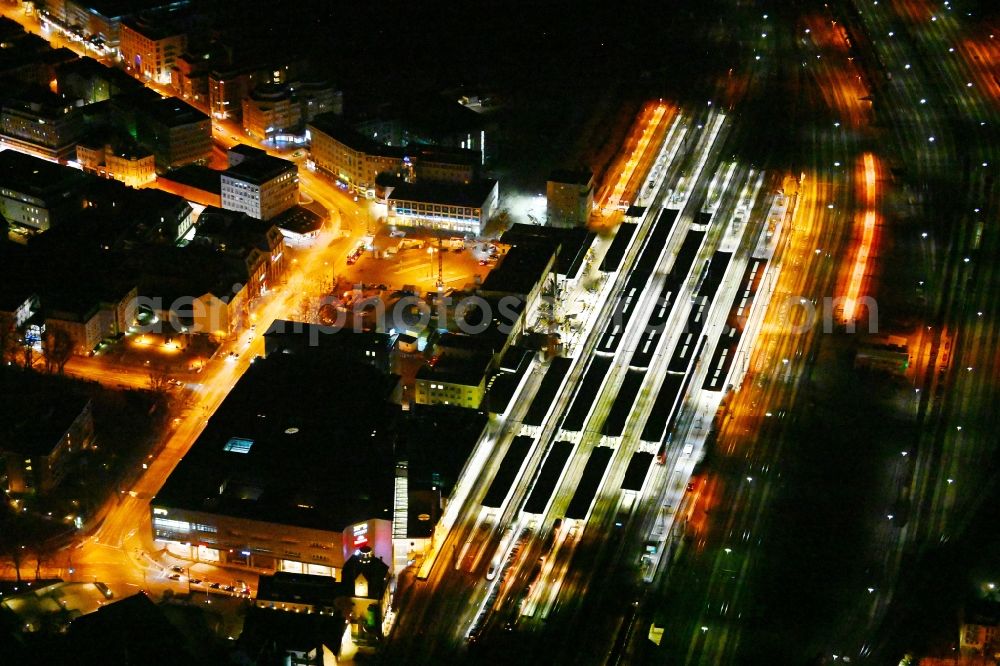 Augsburg at night from above - Night lighting construction work for the reconstruction of the station building Central Station of Deutschen Bahn in Augsburg in the state Bavaria, Germany