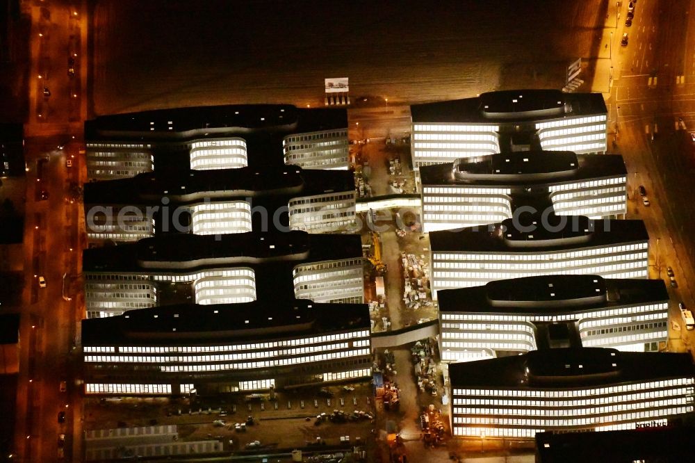 Aerial image at night Berlin - Night lighting construction site to build a new office and commercial building Allianz Campus Berlin in the district Johannisthal - Adlershof in Berlin