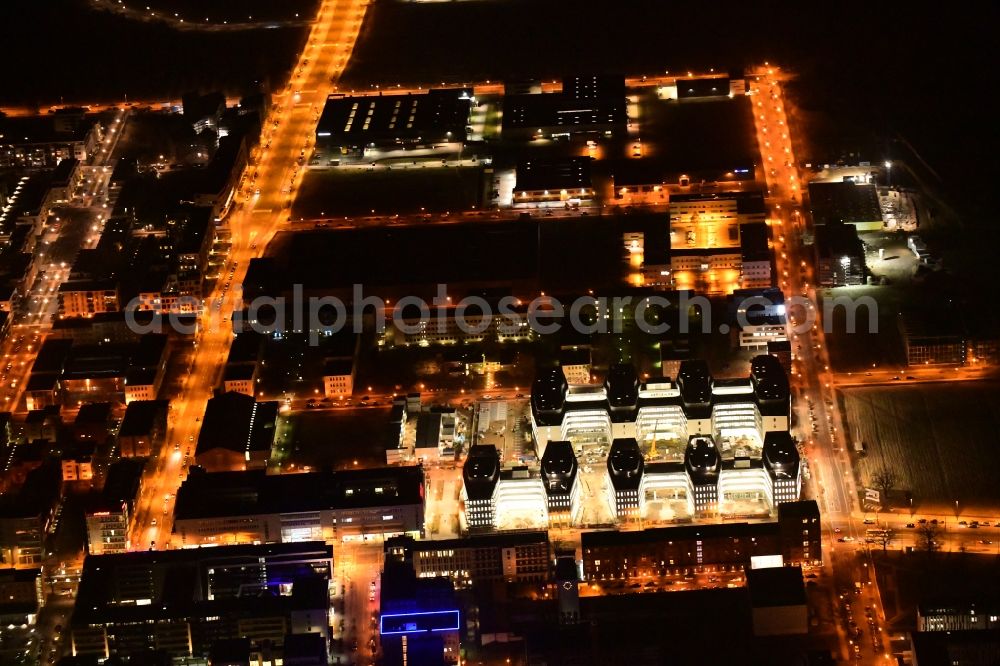 Aerial photograph at night Berlin - Night lighting construction site to build a new office and commercial building Allianz Campus Berlin in the district Johannisthal - Adlershof in Berlin