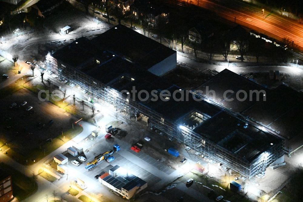 Aerial photograph at night Schwerin - Night lighting construction site for the construction of depots and workshops in Schwerin in Mecklenburg-Vorpommern, Germany