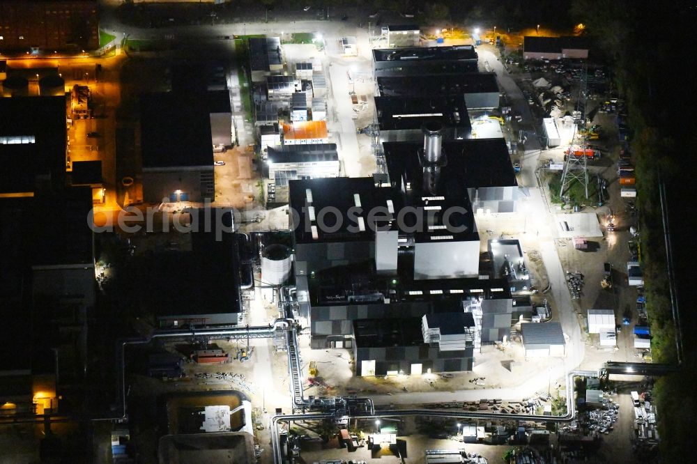 Berlin at night from above - Night lighting construction site of power plants and exhaust towers of thermal power station on Rhinstrasse in the district Marzahn in Berlin, Germany