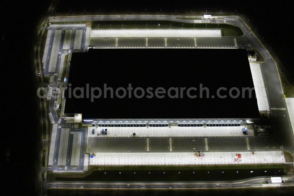 Aerial photograph at night Kiekebusch - Night lighting construction site for the construction of a logistics center of the Achim Walder retailer Amazon in Kiekebusch in the state of Brandenburg, Germany