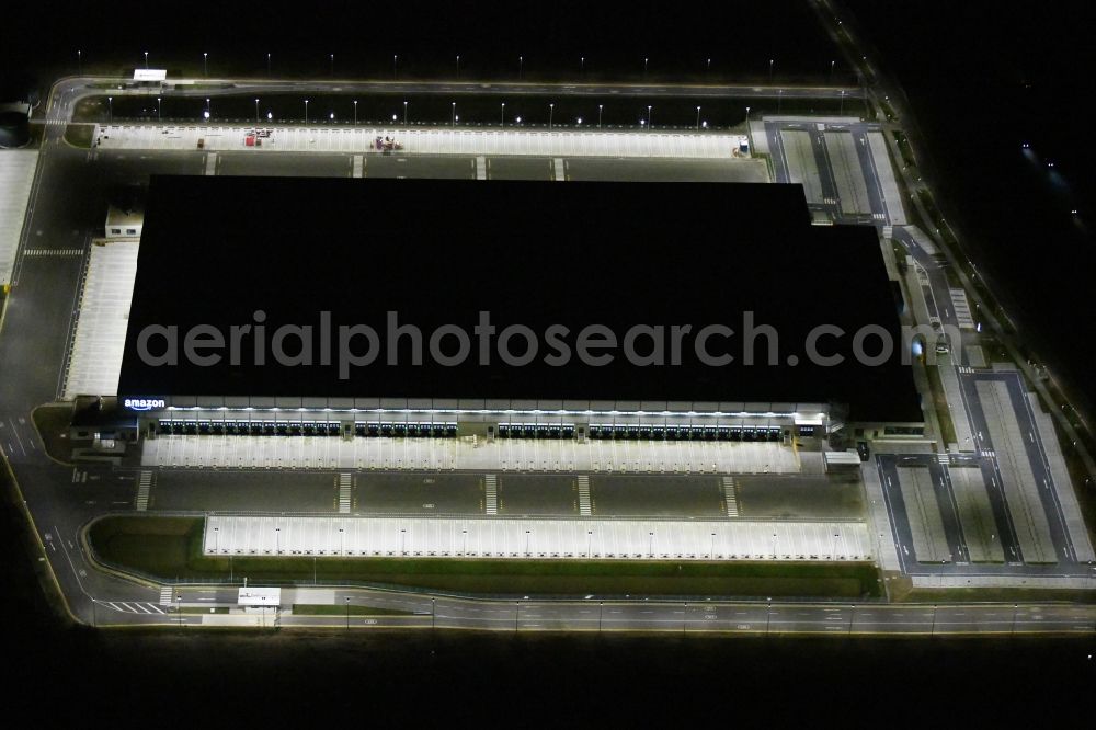 Aerial image at night Kiekebusch - Night lighting construction site for the construction of a logistics center of the Achim Walder retailer Amazon in Kiekebusch in the state of Brandenburg, Germany
