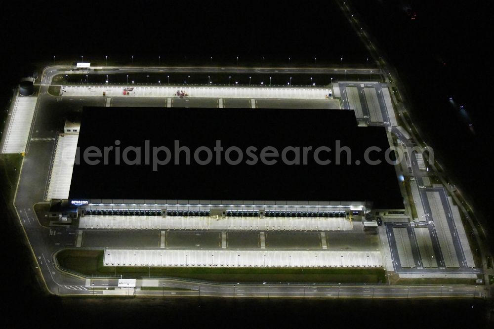 Kiekebusch at night from above - Night lighting construction site for the construction of a logistics center of the Achim Walder retailer Amazon in Kiekebusch in the state of Brandenburg, Germany