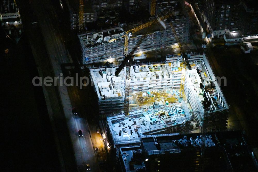 Hamburg at night from above - Night lighting construction site to build a new multi-family residential complex on Baakenallee in the district HafenCity in Hamburg, Germany