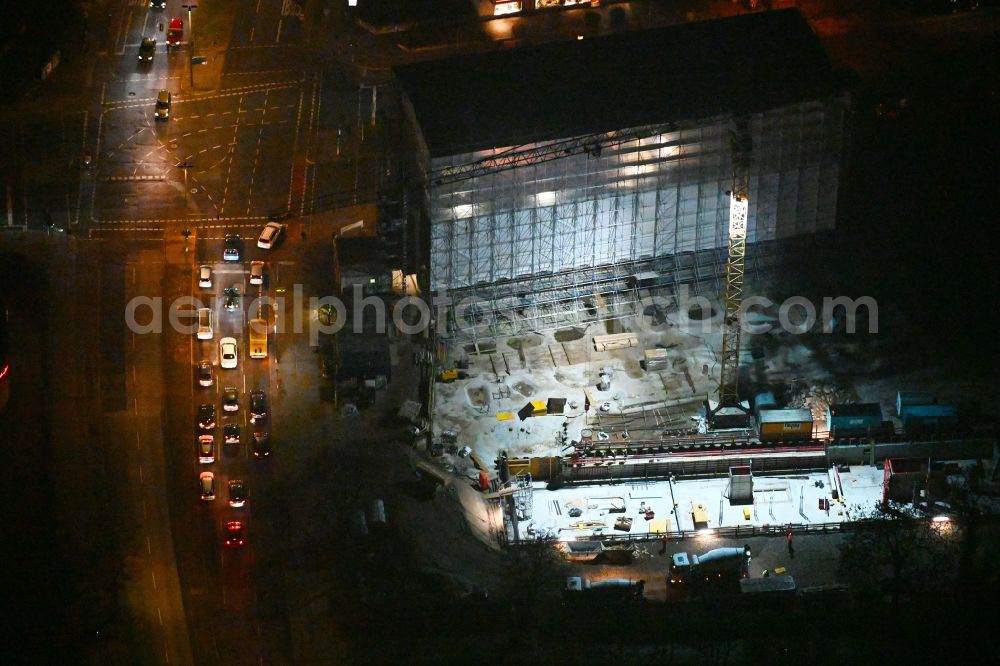 Aerial photograph at night Berlin - Night lighting construction site for the multi-family residential building on Hindenburgdamm corner Koenigsberger Strasse in the district Lichterfelde in Berlin, Germany