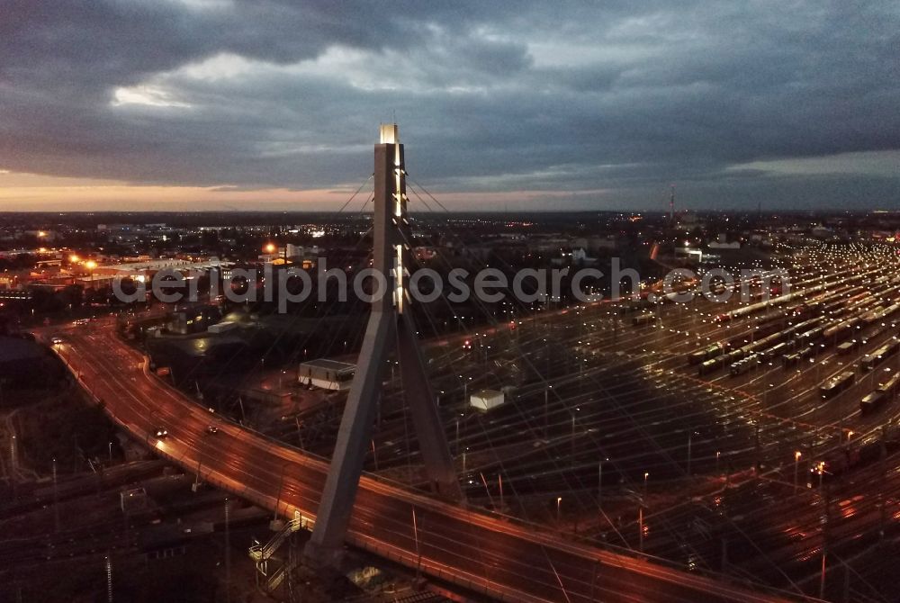 Aerial image at night Halle (Saale) - Night lighting view of Berlin Bridge in Halle (Saale) in Saxony-Anhalt