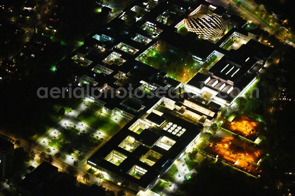 Aerial photograph at night Berlin - Night lighting library Building of Campusbibliothek on Fabeckstrasse in the district Dahlem in Berlin, Germany