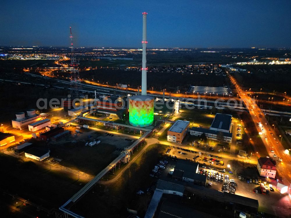Aerial image at night Halle (Saale) - Night lighting power station plants of the combined heat and power station - regional heat on Dieselstrasse in Halle (Saale) in the state Saxony-Anhalt, Germany