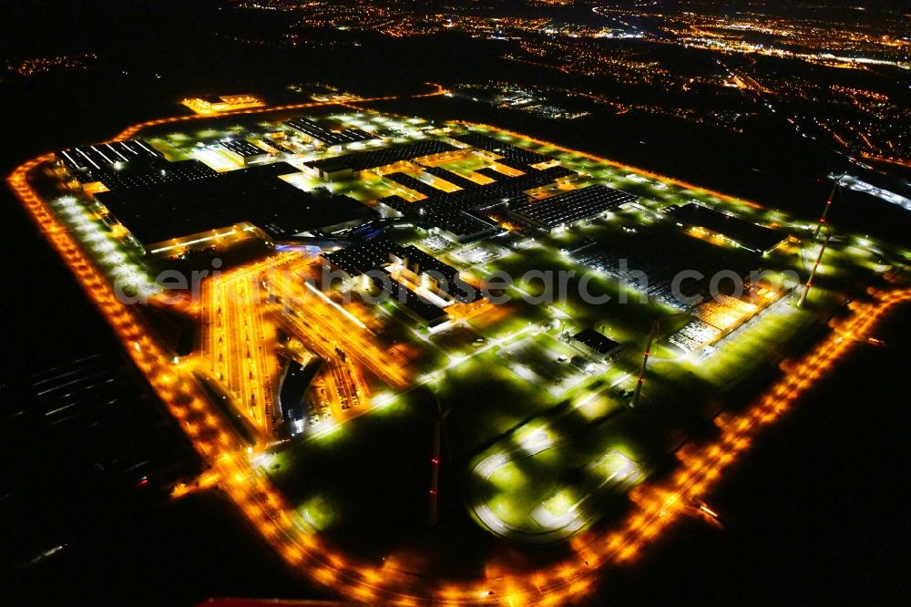 Aerial image at night Leipzig - Night lighting site location of Bayerische Motoren Werke AG BMW Leipzig in Saxony