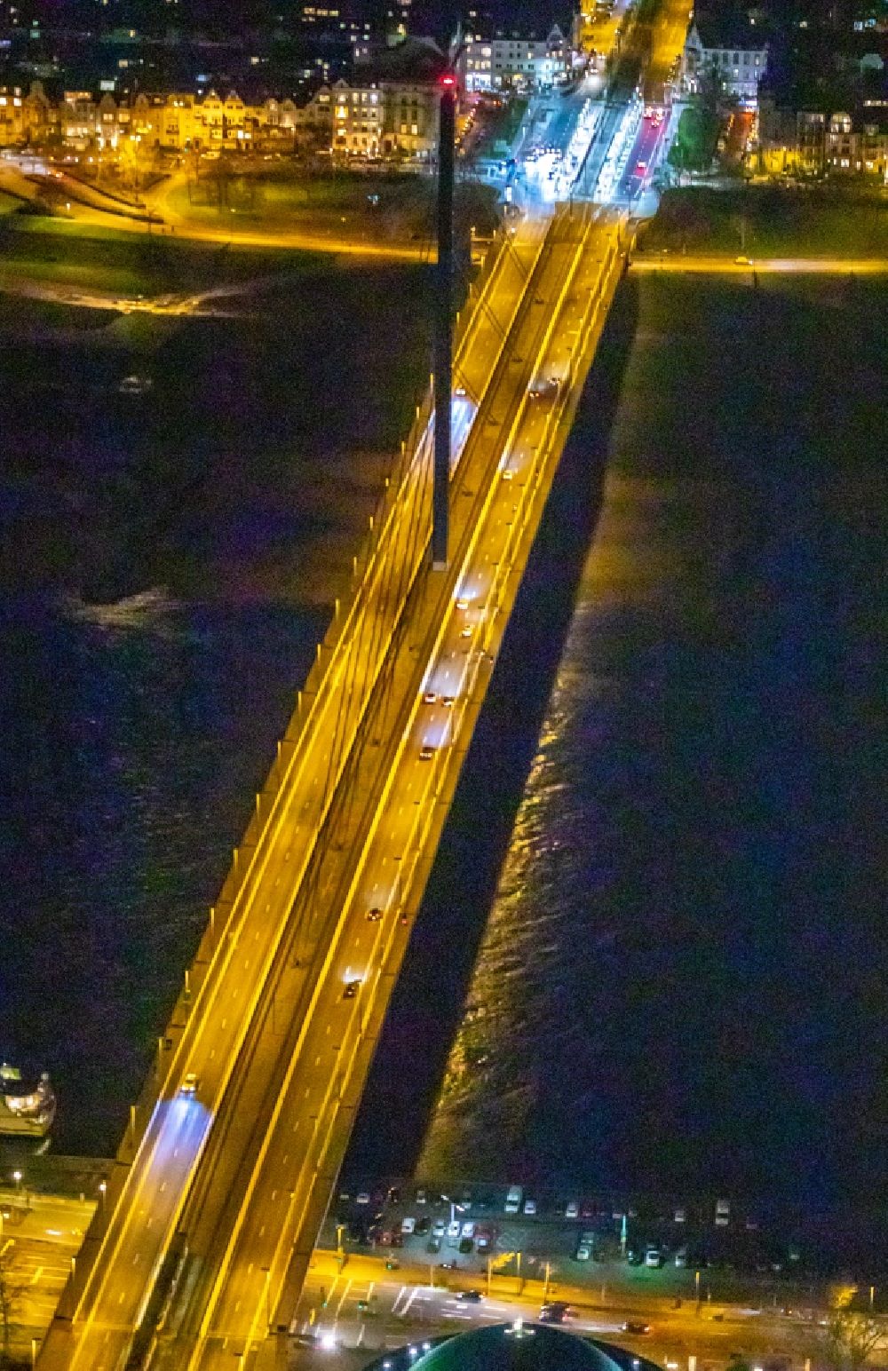 Aerial photograph at night Düsseldorf - Night lighting bridge construction Oberkasseler Bruecke in Duesseldorf in the state North Rhine-Westphalia, Germany