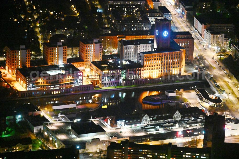 Aerial image at night Berlin - Night lighting office building - Ensemble Ullsteinhaus on Ullsteinstrasse an shopping center Tempelhofer Hafen in the district Tempelhof in Berlin, Germany