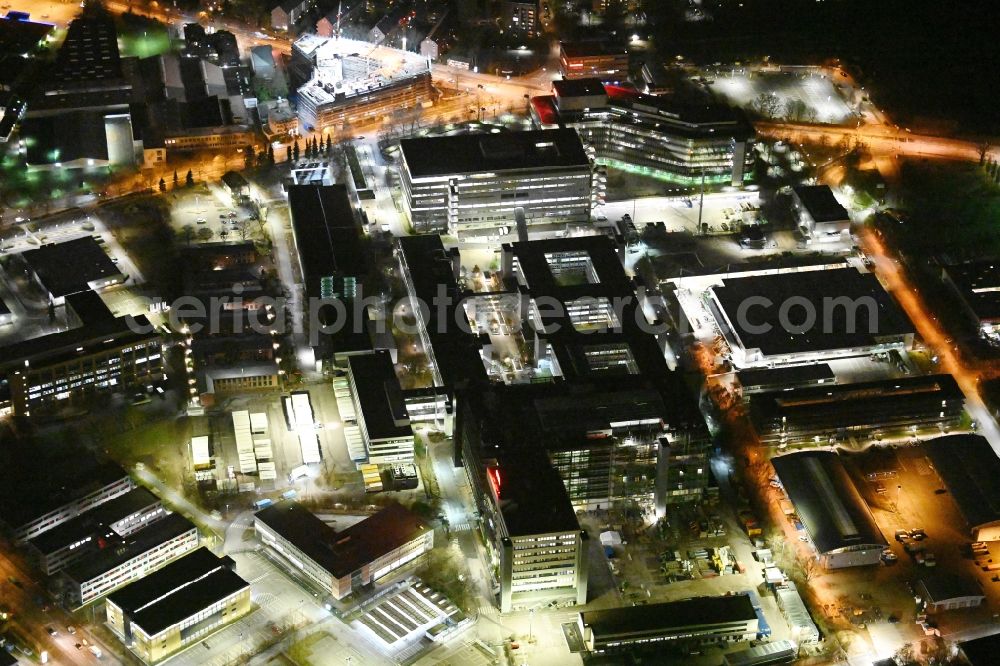 Aerial photograph at night Hamburg - Night lighting office building - Ensemble and structure of OTTO Warenverteilcenter GmbH on Werner-Otto-Strasse in Hamburg, Germany