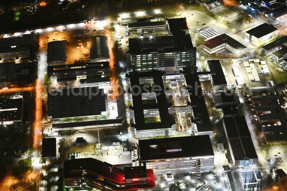 Aerial image at night Hamburg - Night lighting office building - Ensemble and structure of OTTO Warenverteilcenter GmbH on Werner-Otto-Strasse in Hamburg, Germany