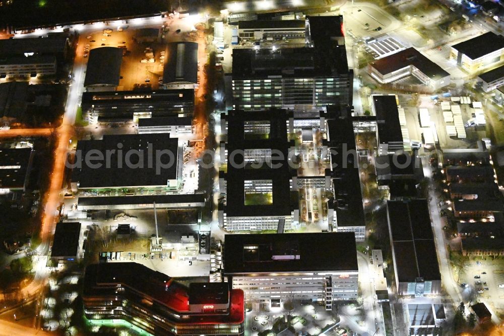 Hamburg at night from above - Night lighting office building - Ensemble and structure of OTTO Warenverteilcenter GmbH on Werner-Otto-Strasse in Hamburg, Germany