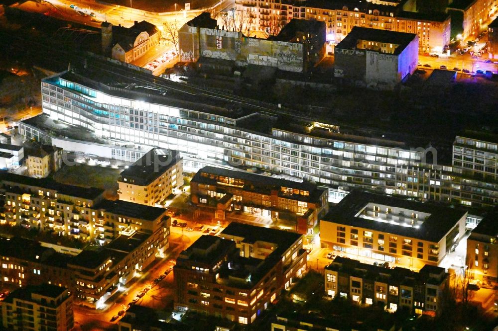 Aerial photograph at night Berlin - Night lighting new office and commercial building B:HUB on Kynaststrasse - Alt-Stralau in Berlin, Germany