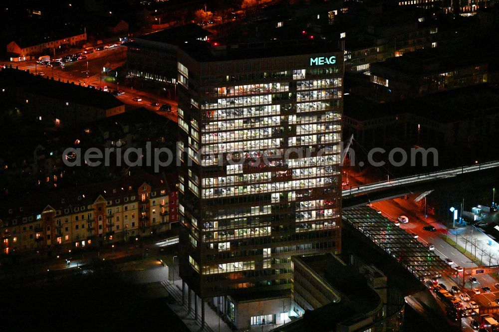 Aerial image at night München - Night lighting office and corporate management high-rise building of MEAG on street Am Muenchner Tor in the district Freimann in Munich in the state Bavaria, Germany