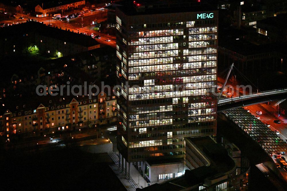 München at night from above - Night lighting office and corporate management high-rise building of MEAG on street Am Muenchner Tor in the district Freimann in Munich in the state Bavaria, Germany