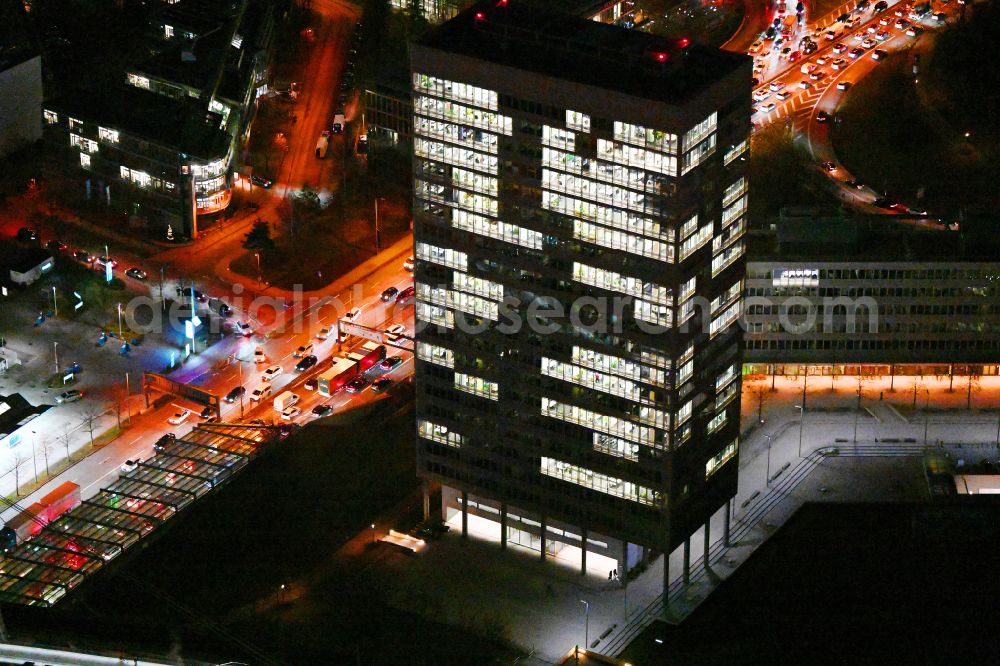 Aerial image at night München - Night lighting office and corporate management high-rise building of MEAG on street Am Muenchner Tor in the district Freimann in Munich in the state Bavaria, Germany