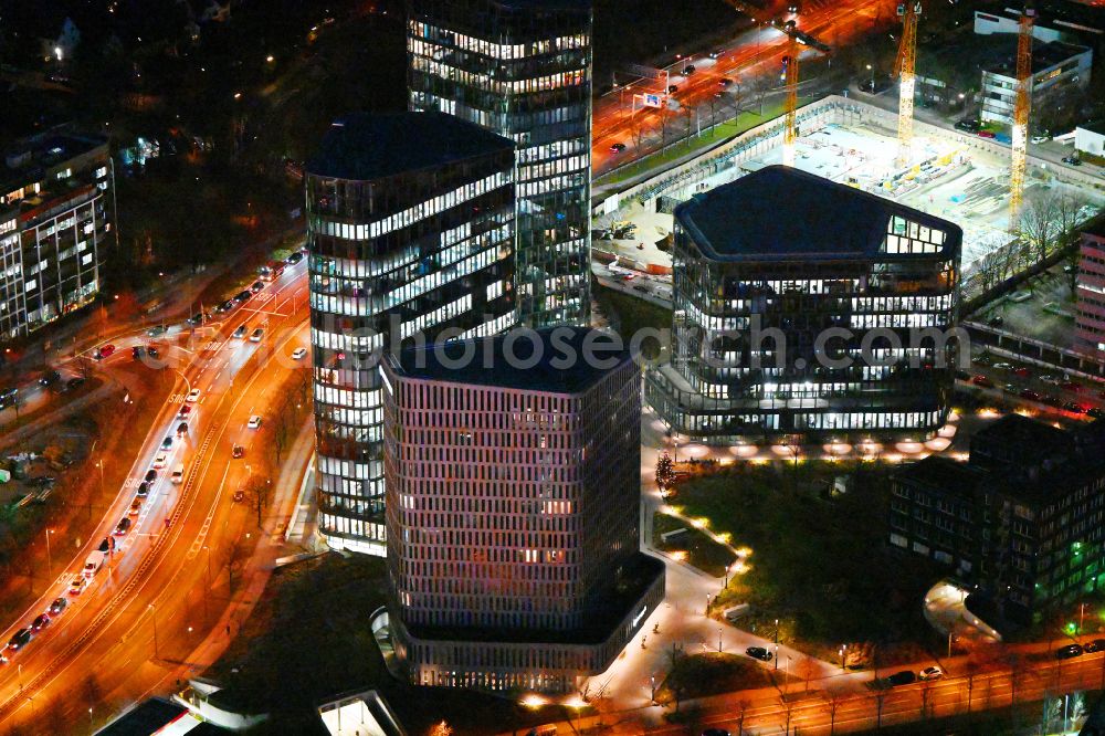 München at night from above - Night lighting office building of the administration and business house ensemble Bavaria Towers on Truderinger Strasse in the district on street Riedenburger Strasse of Bogenhausen in Munich in the state Bavaria, Germany