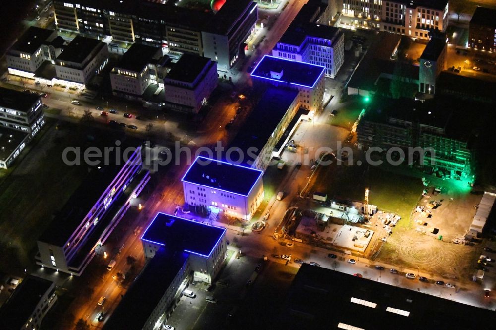 Aerial photograph at night Berlin - Night lighting office building of ARRI Lighting Solutions GmbH in the district Adlershof in Berlin, Germany