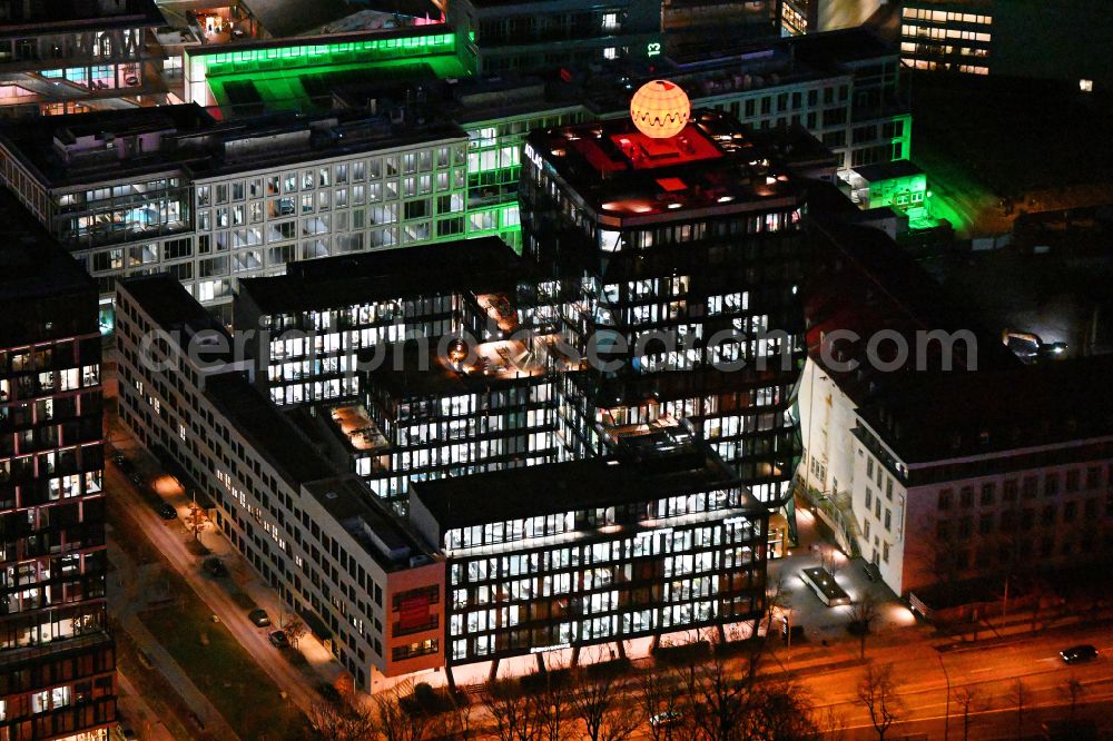 München at night from the bird perspective: Night lighting office building ATLAS in factorysviertel on Gisela-Stein-Strasse in the district Berg am Laim in Munich in the state Bavaria, Germany