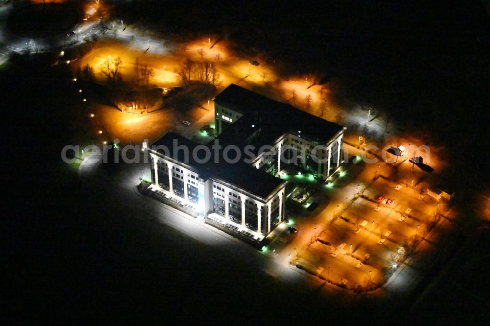 Kabelsketal at night from the bird perspective: Night lighting office building Europa Center in the district Grosskugel in Kabelsketal in the state Saxony-Anhalt, Germany