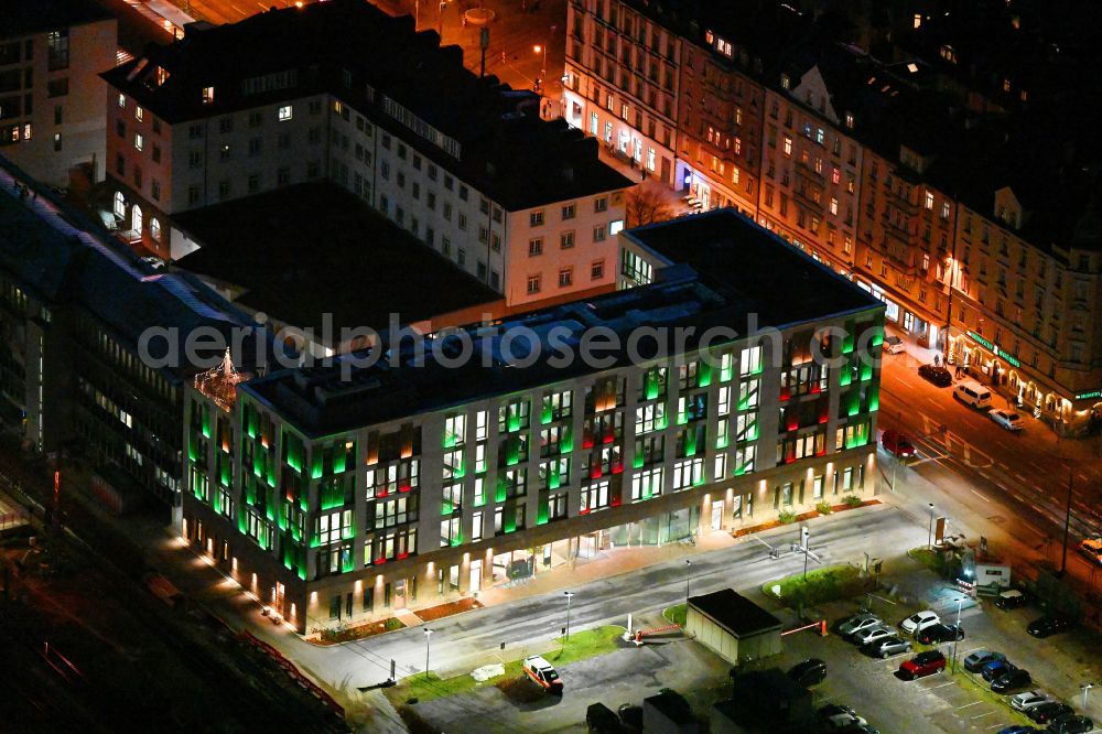 München at night from the bird perspective: Night lighting office building of GVG Immobilien Service GmbH on street Orleansstrasse - Orleansplatz in the district Au-Haidhausen in Munich in the state Bavaria, Germany