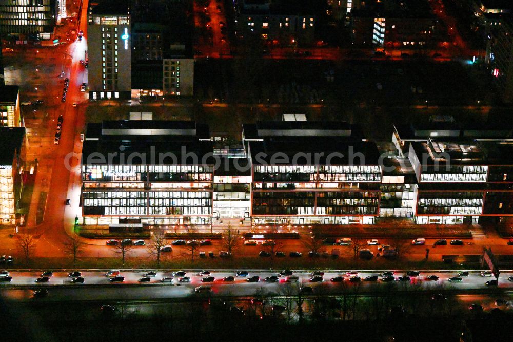 Aerial photograph at night München - Night lighting office building of Microsoft Deutschland GmbH on street Walter-Gropius-Strasse in the district Freimann in Munich in the state Bavaria, Germany