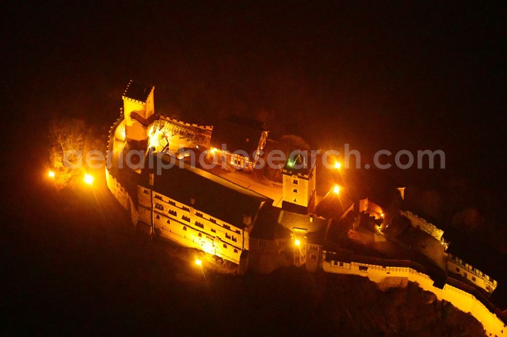 Aerial photograph at night Eisenach - Night lighting Castle of the fortress Wartburg-Stiftung Eisenach in Eisenach in the state Thuringia, Germany