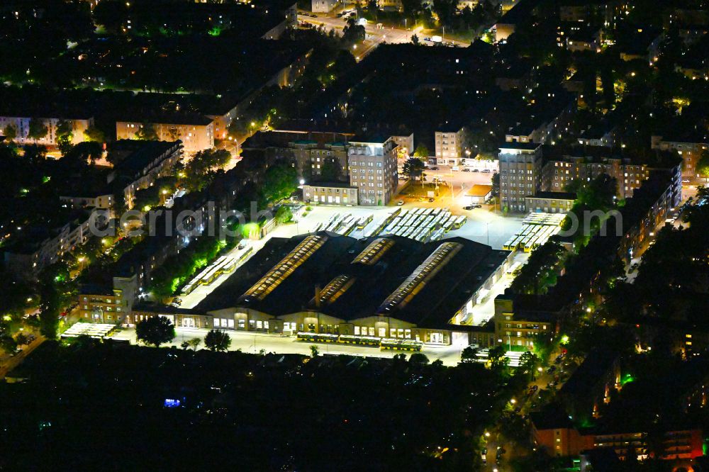 Aerial photograph at night Berlin - Night lighting depot of the Municipal Transport Company BVG Omnibusbetriebshof Muellerstrasse in the district Wedding in Berlin, Germany