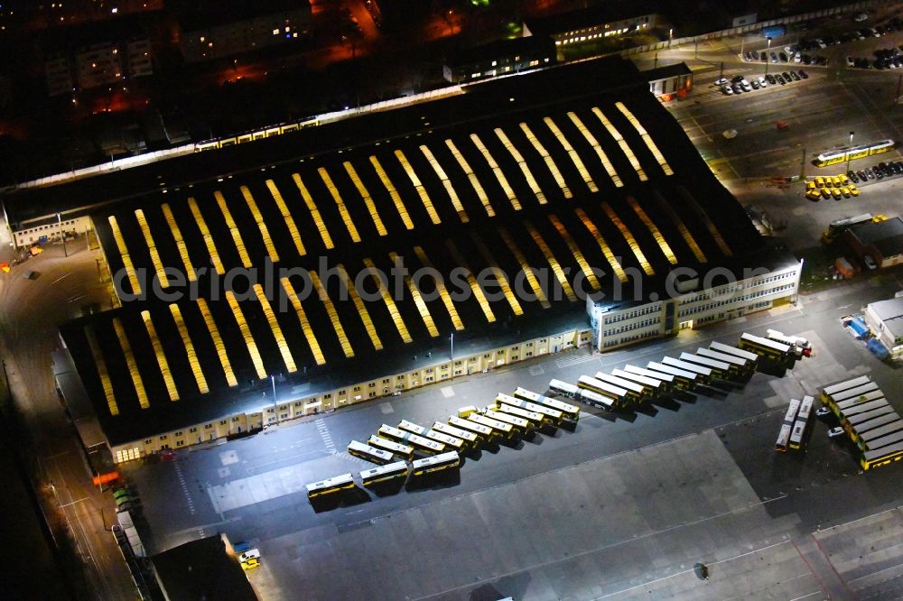 Aerial photograph at night Berlin - Night lighting bVG bus and train station in the district Lichtenberg in Berlin