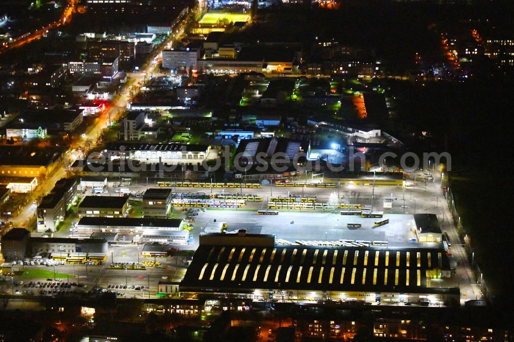 Aerial photograph at night Berlin - Night lighting bVG bus and train station in the district Lichtenberg in Berlin