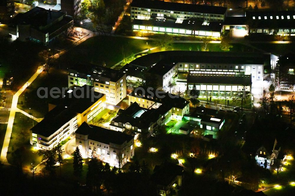 Aerial image at night Berlin - Night lighting Campus building of the university Freie Universitaet Berlin in the district Dahlem in Berlin, Germany