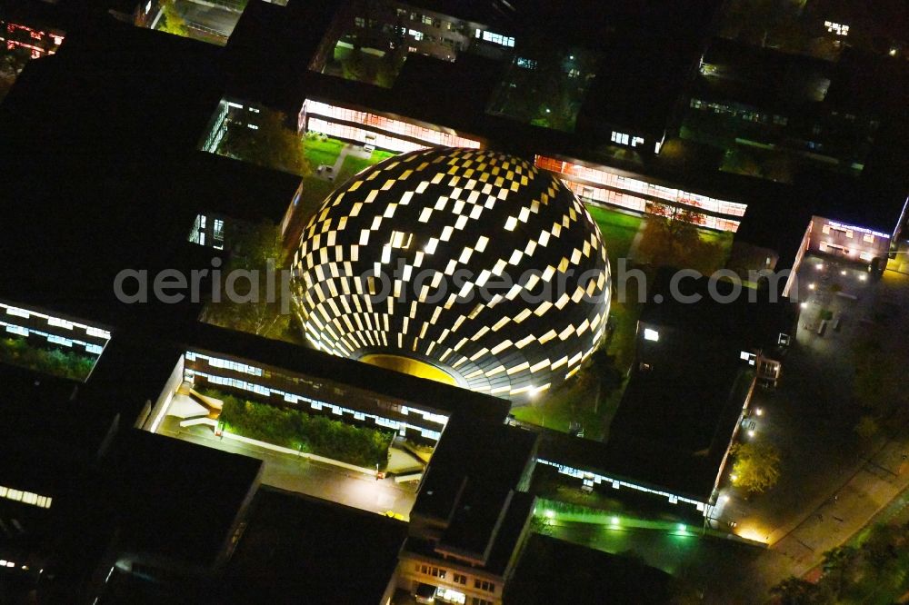 Aerial photograph at night Berlin - Night lighting campus building of the university Freie Universitaet Berlin with the building of the Philological Library in the Habelschwerdter Allee in the district Dahlem in Berlin