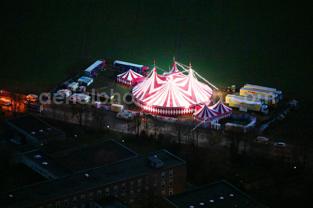 Aerial image at night München - Night lighting circus tent domes of the circus Cyrk Waterland on street Weinbergerstrasse in the district Pasing in Munich in the state Bavaria, Germany