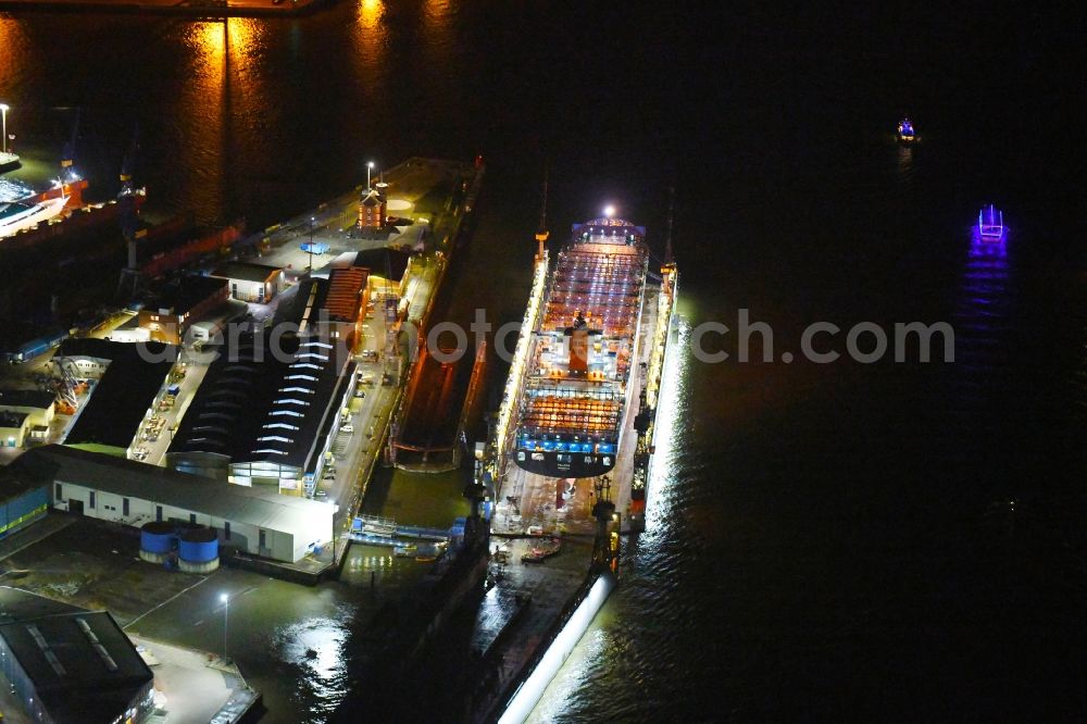 Hamburg at night from above - Night lighting container ship PALENA in dry dock in the port in the district Steinwerder in Hamburg, Germany