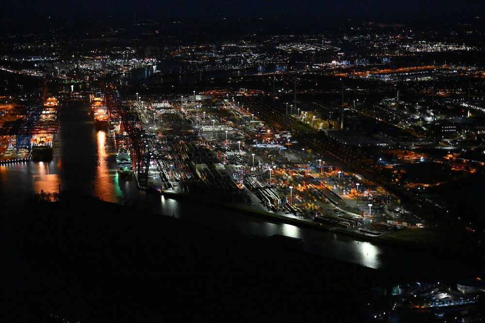 Aerial image at night Hamburg - Night lighting container Terminal in the port of the international port of the EUROGATE Container Terminal Hamburg GmbH im Morgennebel in Hamburg