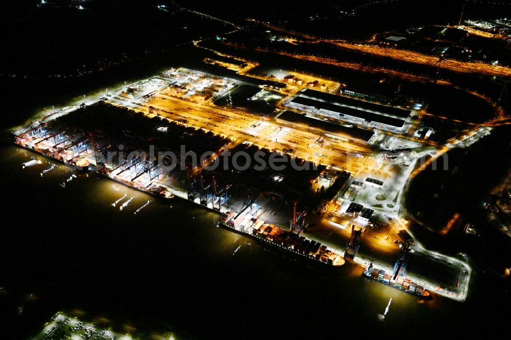 Aerial photograph at night Hamburg - Night lighting container Terminal HHLA Container Terminal Altenwerder (CTA) on the Elbe riverbank in the Altenwerder part of Hamburg in Germany