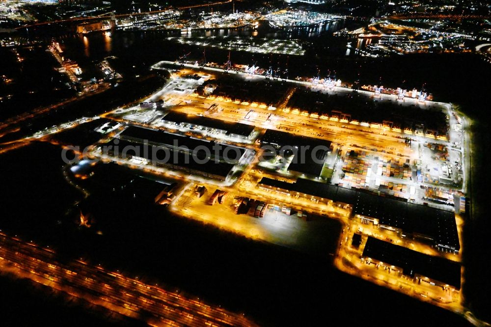 Hamburg at night from the bird perspective: Night lighting container Terminal HHLA Container Terminal Altenwerder (CTA) on the Elbe riverbank in the Altenwerder part of Hamburg in Germany