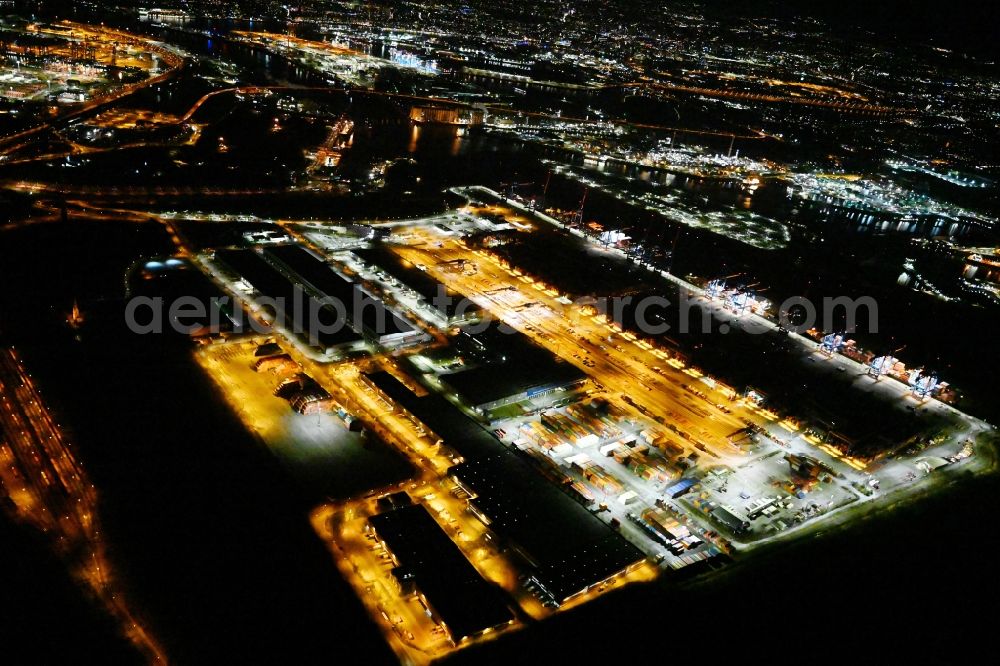Aerial photograph at night Hamburg - Night lighting container Terminal HHLA Container Terminal Altenwerder (CTA) on the Elbe riverbank in the Altenwerder part of Hamburg in Germany
